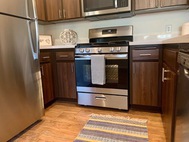 Ritiro Apartments Las Vegas brown cabinet stainless steel appliances